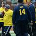 Former Michigan football player David Fisher carries the ball during the annual alumni flag football game before spring practice at Michigan Stadium on Saturday, April 13, 2013. Melanie Maxwell I AnnArbor.com